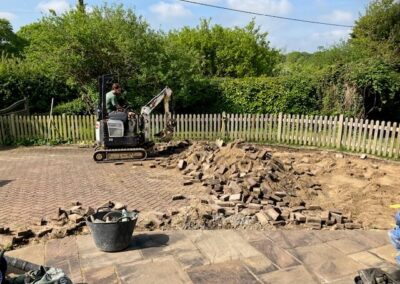 Removing the previous driveway.